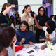 Dascha Polanco (enter) and attendees and organizers of the Dove self-esteem workshop